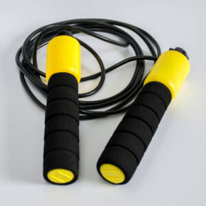 Yellow jump rope on white ground