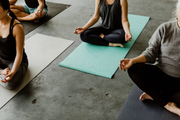 People meditating in a yoga class